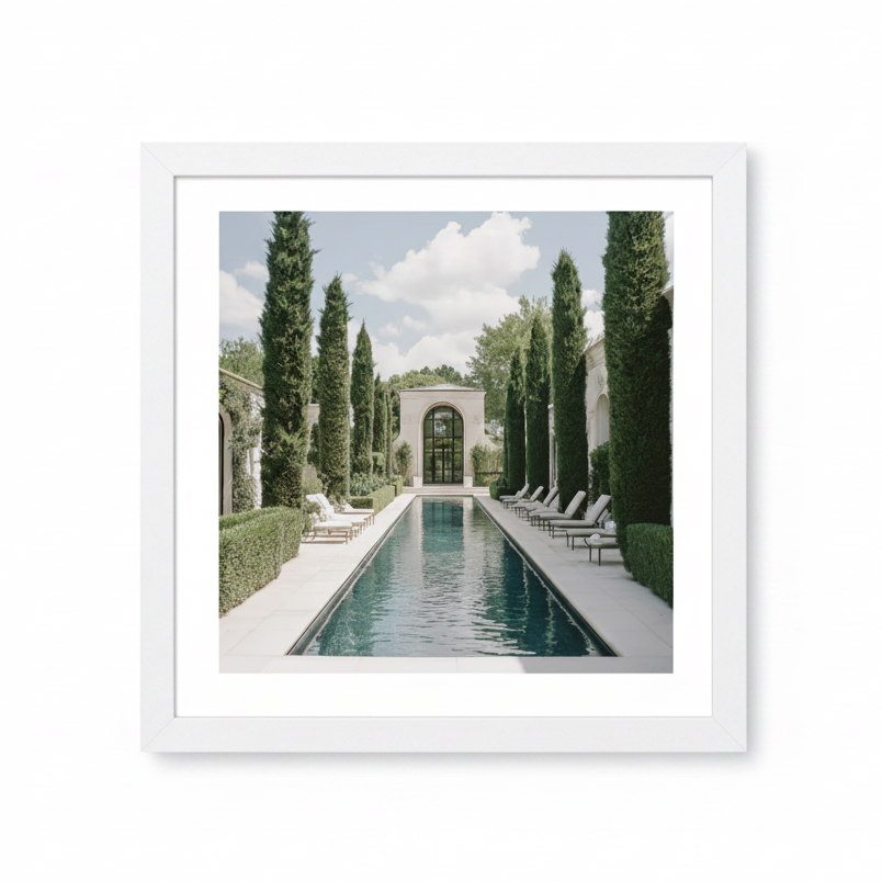 Luxury pool with lounge chairs and tall trees in a garden setting