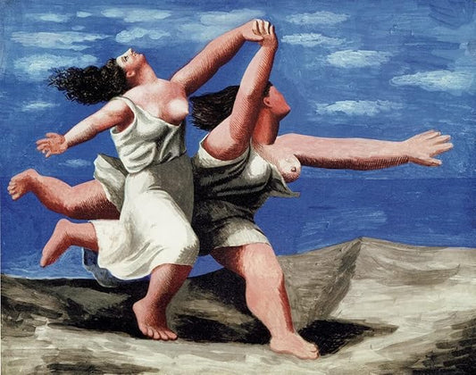 Two women running on the beach