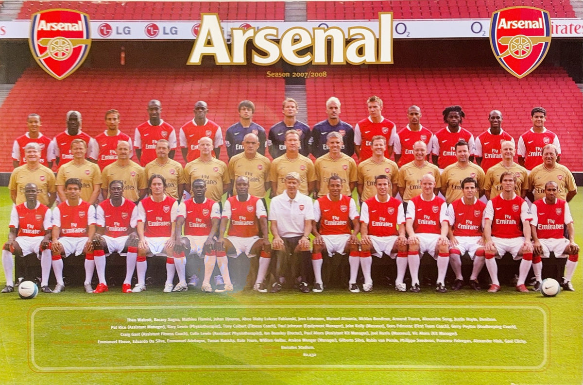 Arsenal football team photo with players in red and white uniforms and club logo.