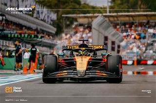 Formula 1 car on a track with spectators and branding in the background. McLaren Mercedes-Benz F1 - Oscar Piastri Melbourne