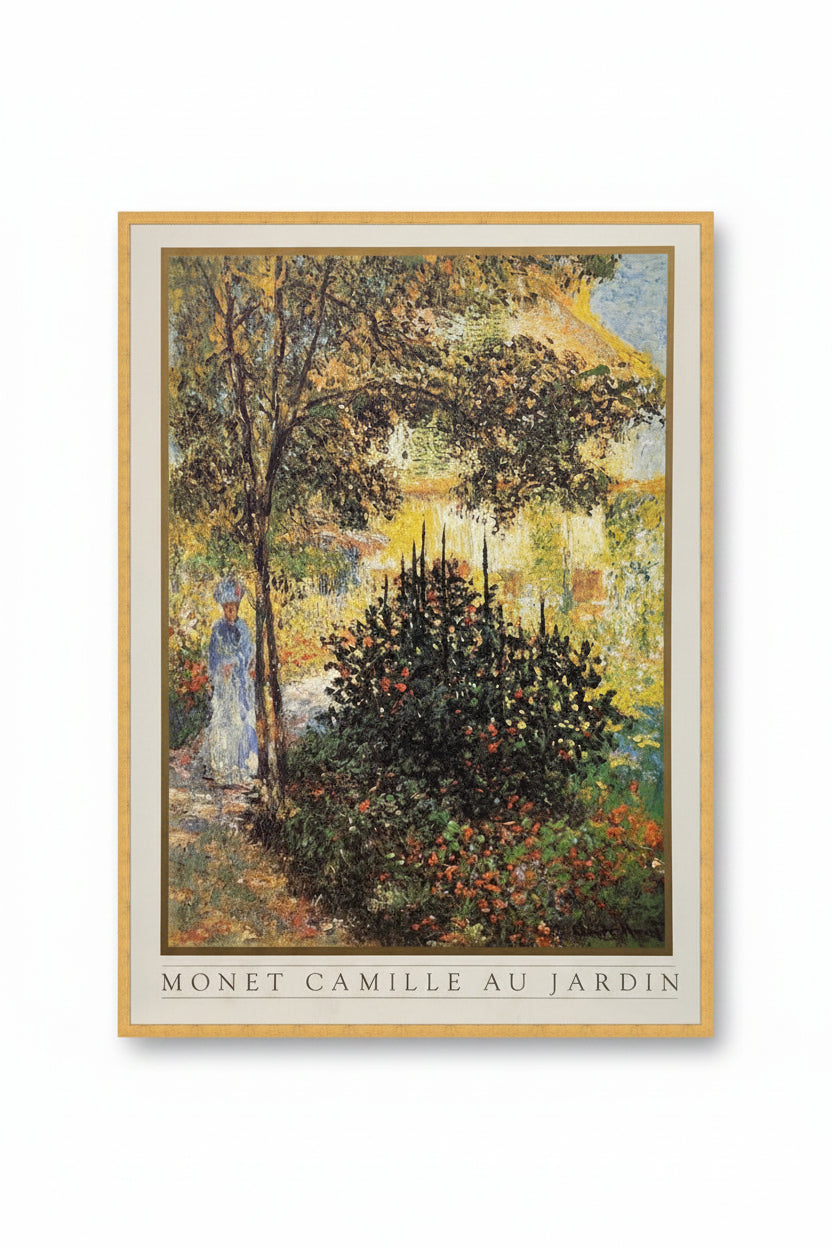 A framed print featuring Monet's painting of Camille in the garden, with non-reflective glass and a yellow frame.